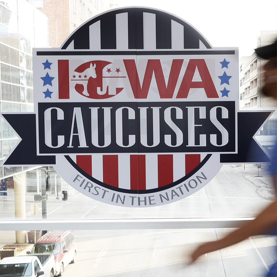 photo of an Iowa caucuses logo on a window 